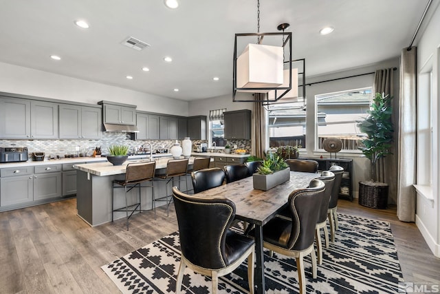 dining space featuring recessed lighting and light wood finished floors