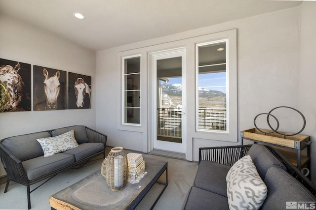 living room with carpet floors and recessed lighting