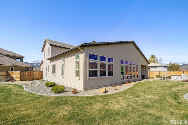 rear view of property featuring a mountain view