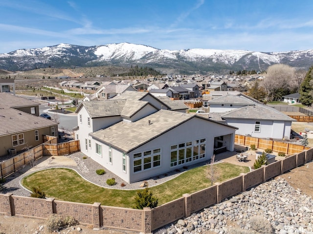 aerial view of residential area with a mountainous background