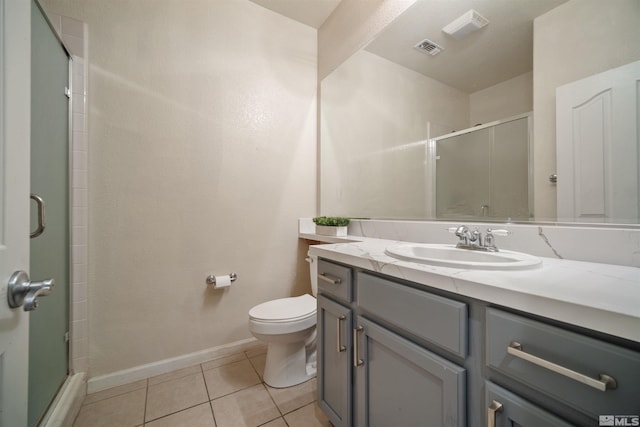 2590 Spring Flower Dr, Reno, NV 89521 - bathroom with a shower stall, toilet, tile patterned floors, vanity, and baseboards