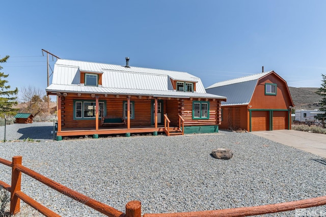 15290 Cherrywood Dr, Reno, NV 89511 - log cabin with log siding, an outdoor structure, and metal roof