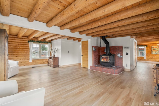 15290 Cherrywood Dr, Reno, NV 89511 - unfurnished living room with wooden ceiling, light wood-style floors, baseboards, a wood stove, and beamed ceiling