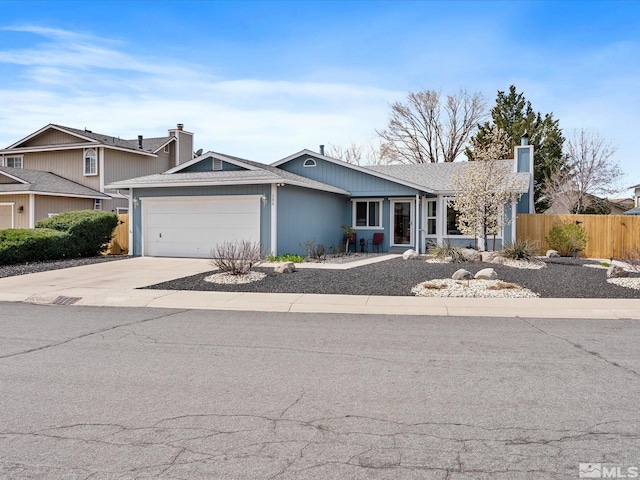 286 Woodlake Cir, Dayton, NV 89403 - view of front of property featuring fence, a garage, concrete driveway, and a chimney