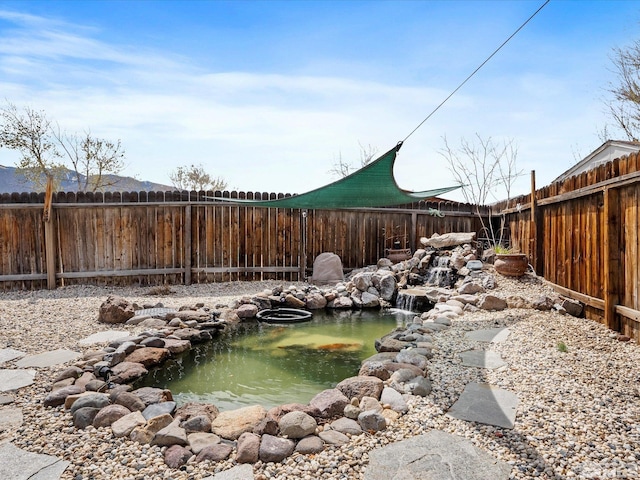 286 Woodlake Cir, Dayton, NV 89403 - view of yard featuring a garden pond and fence