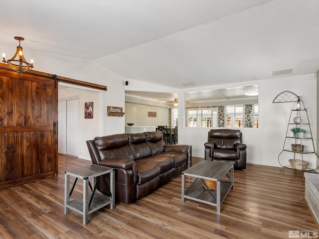 286 Woodlake Cir, Dayton, NV 89403 - living room with wood finished floors, lofted ceiling, a barn door, and a chandelier