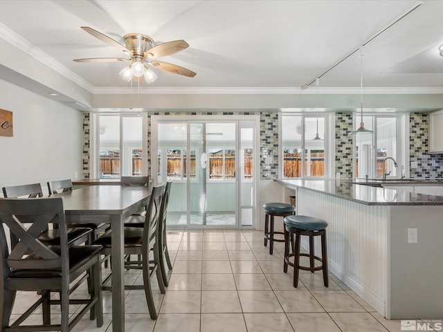 286 Woodlake Cir, Dayton, NV 89403 - dining room featuring a ceiling fan, ornamental molding, plenty of natural light, and light tile patterned flooring