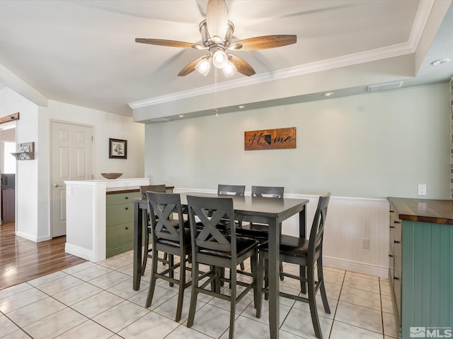 286 Woodlake Cir, Dayton, NV 89403 - dining space featuring ornamental molding, a ceiling fan, wainscoting, and light tile patterned floors
