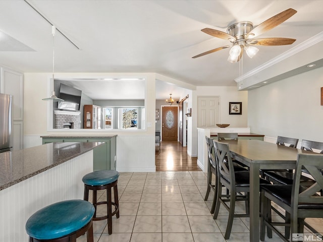 286 Woodlake Cir, Dayton, NV 89403 - dining space with a ceiling fan, track lighting, and a fireplace