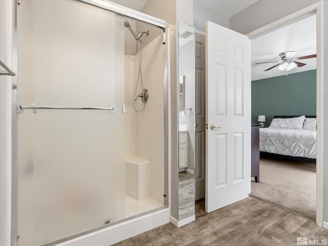 286 Woodlake Cir, Dayton, NV 89403 - ensuite bathroom featuring a shower stall, ceiling fan, and wood finished floors