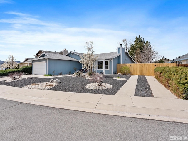 286 Woodlake Cir, Dayton, NV 89403 - mid-century home featuring fence, a chimney, and an attached garage