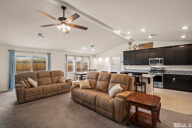 1981 Lanstar Dr, Sparks, NV 89441 - living room featuring light colored carpet, healthy amount of natural light, ceiling fan, and recessed lighting