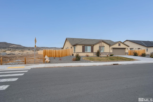 1981 Lanstar Dr, Sparks, NV 89441 - single story home with stucco siding, fence, an attached garage, and driveway
