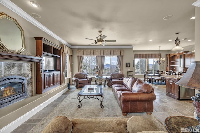 5140 Belsera Ct, Reno, NV 89519 - living room with healthy amount of natural light, recessed lighting, crown molding, a high end fireplace, and a ceiling fan