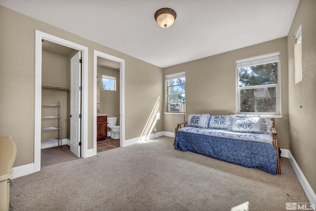 5140 Belsera Ct, Reno, NV 89519 - bedroom with carpet, ensuite bathroom, and baseboards
