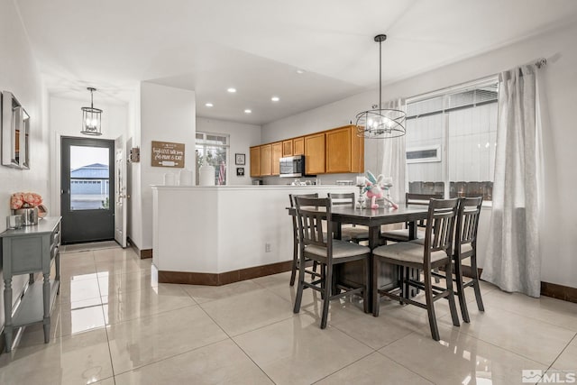 9745 Stone Vista Ct, Reno, NV 89506 - dining area featuring a chandelier, light tile patterned floors, baseboards, and recessed lighting