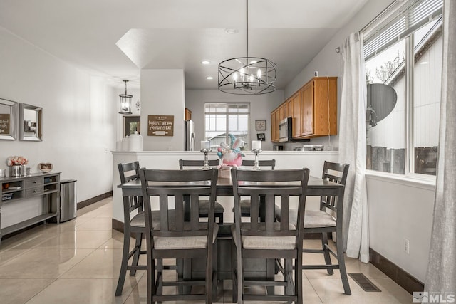 9745 Stone Vista Ct, Reno, NV 89506 - dining space featuring a chandelier, light tile patterned floors, baseboards, and recessed lighting