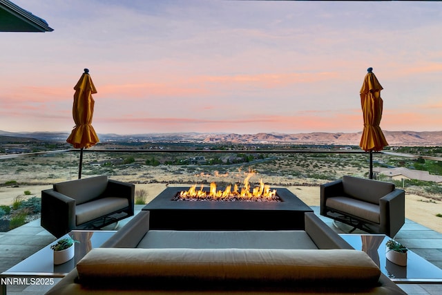 6372 Mormon Tea Way, Reno, NV 89511 - view of patio with a mountain view and an outdoor living space with a fire pit