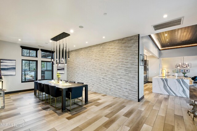6372 Mormon Tea Way, Reno, NV 89511 - dining room featuring recessed lighting, light wood-style floors, and a chandelier