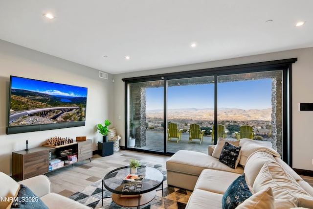 6372 Mormon Tea Way, Reno, NV 89511 - living area featuring light wood-style flooring, recessed lighting, and a mountain view