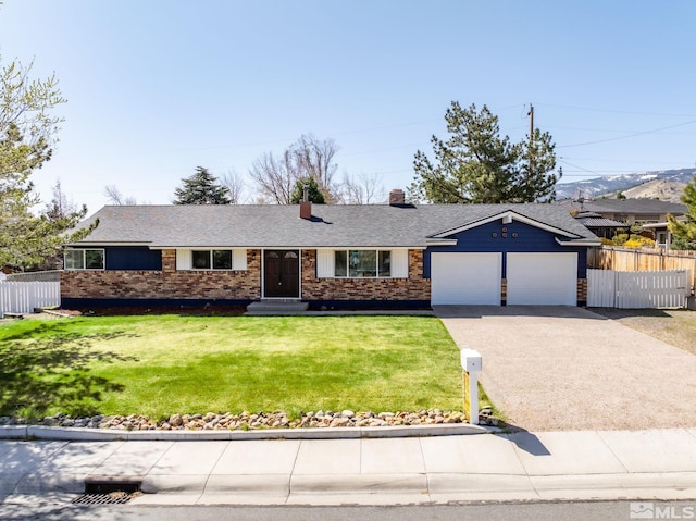 3390 Cashill Blvd, Reno, NV 89509 - single story home with a garage, driveway, brick siding, and a chimney