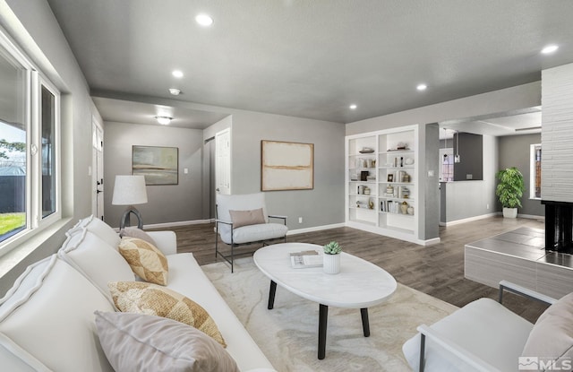3390 Cashill Blvd, Reno, NV 89509 - living area with baseboards, recessed lighting, wood finished floors, and built in features