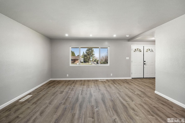 3390 Cashill Blvd, Reno, NV 89509 - unfurnished living room featuring wood finished floors, baseboards, and recessed lighting
