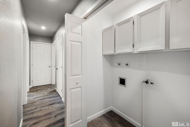 3390 Cashill Blvd, Reno, NV 89509 - washroom featuring hookup for a washing machine, dark wood-style flooring, cabinet space, baseboards, and electric dryer hookup