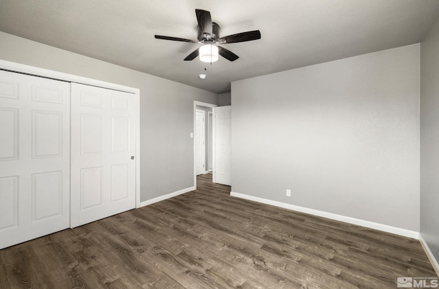 3390 Cashill Blvd, Reno, NV 89509 - unfurnished bedroom with baseboards, dark wood-style flooring, and a closet