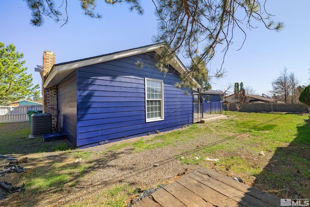 3390 Cashill Blvd, Reno, NV 89509 - view of home's exterior featuring cooling unit and a chimney