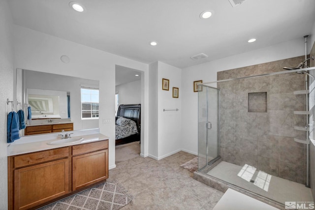 2248 Musselshell Dr, Sparks, NV 89436 - ensuite bathroom with a shower stall, recessed lighting, vanity, tile patterned flooring, and baseboards