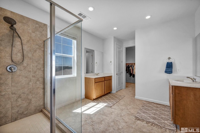 2248 Musselshell Dr, Sparks, NV 89436 - bathroom with vanity, a shower stall, recessed lighting, a spacious closet, and baseboards