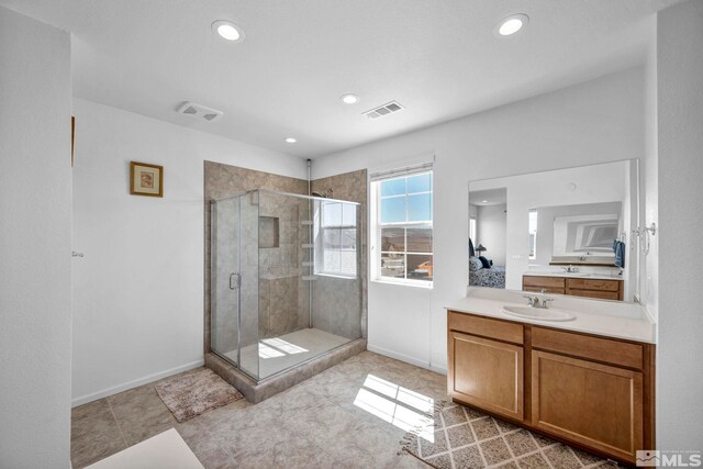 2248 Musselshell Dr, Sparks, NV 89436 - bathroom featuring a stall shower, vanity, recessed lighting, baseboards, and tile patterned floors
