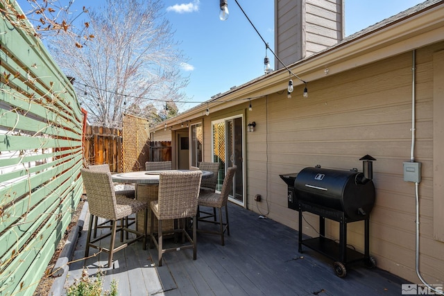 5148 Driftstone Ave, Reno, NV 89523 - wooden deck with fence, outdoor dining area, and a grill