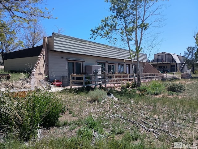 655 Alamosa Dr, Sparks, NV 89441 - rear view of property featuring a wooden deck