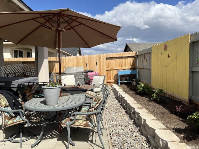 1117 Dapple Dr, Minden, NV 89423 - view of patio with fence, grilling area, and an outdoor fire pit