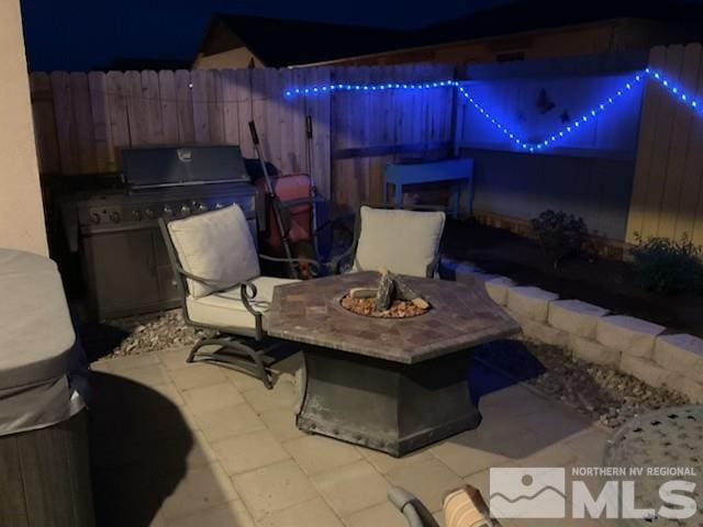 1117 Dapple Dr, Minden, NV 89423 - view of patio with an outdoor fire pit, area for grilling, and fence