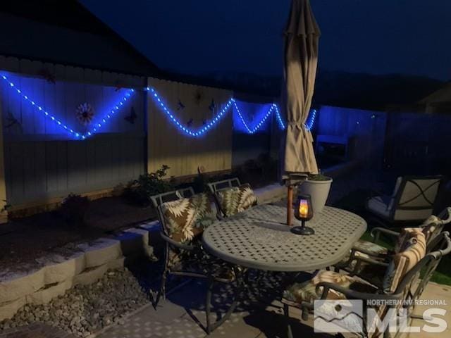 1117 Dapple Dr, Minden, NV 89423 - patio at night featuring outdoor dining space