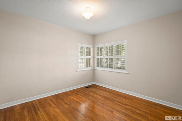 1100 Keystone Ave, Reno, NV 89503 - empty room with baseboards and wood finished floors