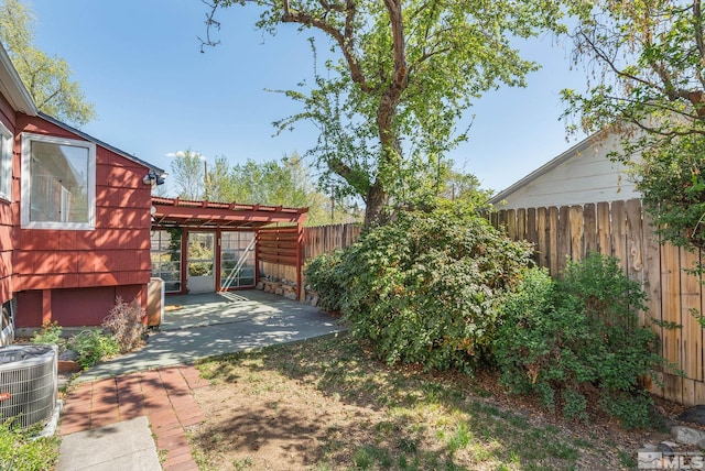 1100 Keystone Ave, Reno, NV 89503 - fenced backyard featuring a patio, central AC unit, and a pergola