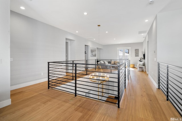 5424 Side Saddle Trl, Reno, NV 89511 - hall with an upstairs landing, light wood-type flooring, baseboards, and recessed lighting