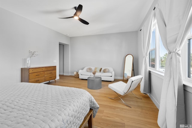 5424 Side Saddle Trl, Reno, NV 89511 - bedroom with light wood-style flooring, baseboards, and ceiling fan