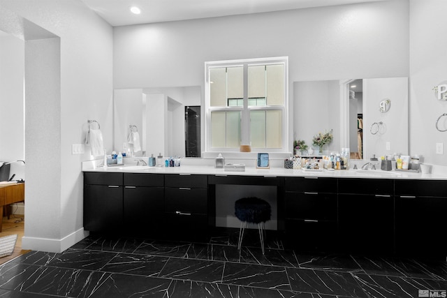 5424 Side Saddle Trl, Reno, NV 89511 - full bathroom featuring baseboards, vanity, and marble look tiles