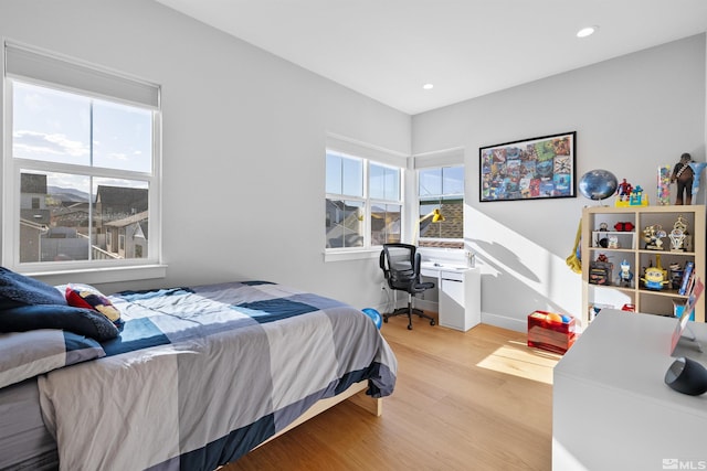 5424 Side Saddle Trl, Reno, NV 89511 - bedroom with wood finished floors, multiple windows, an office area, recessed lighting, and baseboards