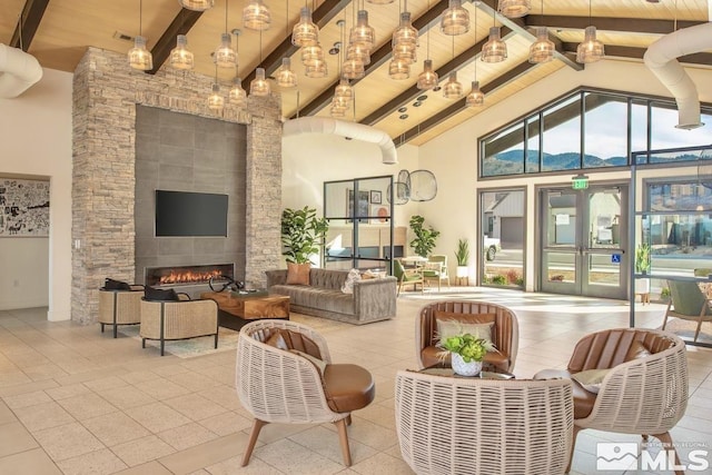 building lobby featuring wooden ceiling, high vaulted ceiling, and beamed ceiling