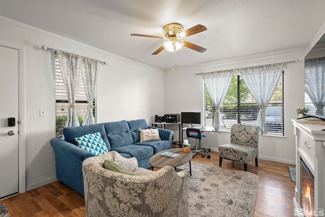 1465 E Peckham Ln Unit 9, Reno, NV 89502 - living room featuring ceiling fan, wood finished floors, and crown molding