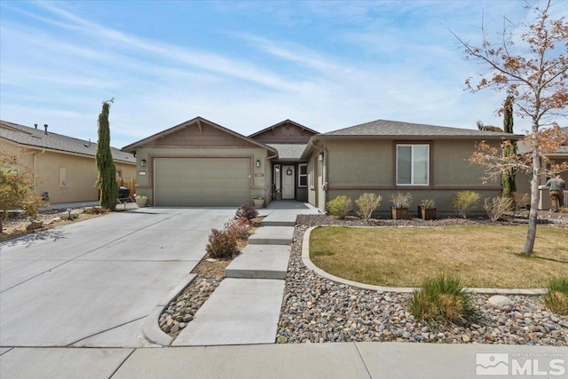 8555 Spearhead Way, Reno, NV 89506 - ranch-style home featuring concrete driveway, an attached garage, stucco siding, and a front yard
