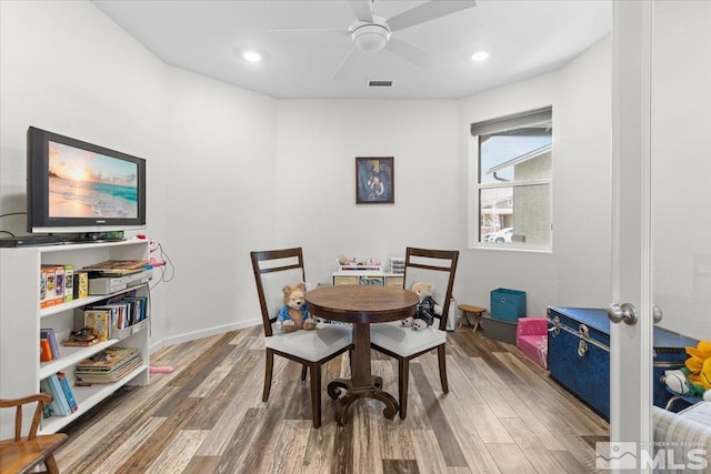 8555 Spearhead Way, Reno, NV 89506 - dining area featuring wood finished floors, ceiling fan, recessed lighting, and baseboards
