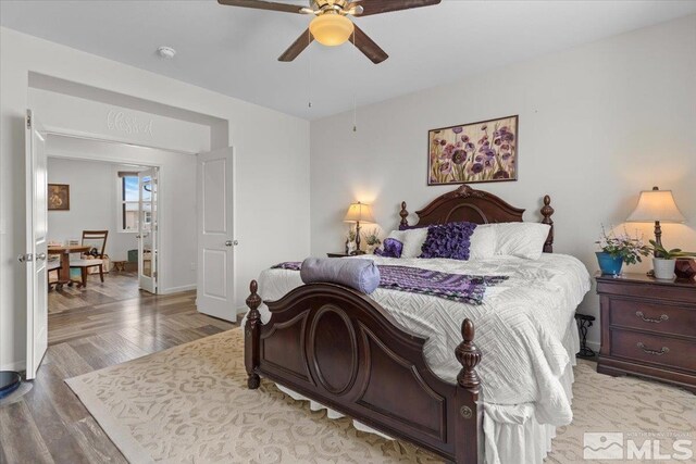 8555 Spearhead Way, Reno, NV 89506 - bedroom featuring light wood-style floors, baseboards, and ceiling fan
