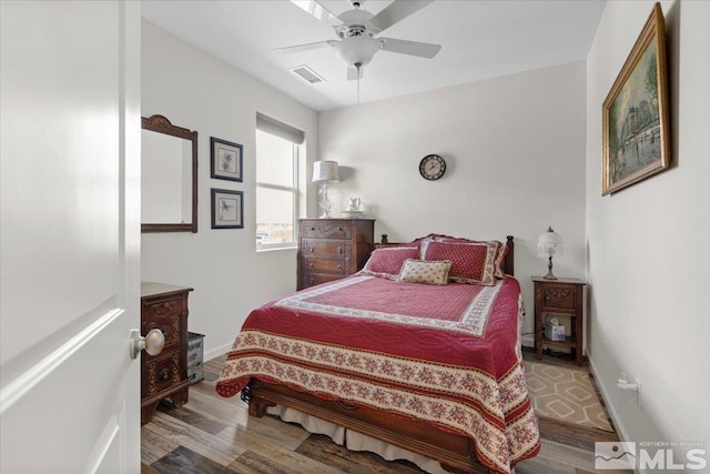 8555 Spearhead Way, Reno, NV 89506 - bedroom with wood finished floors, baseboards, and ceiling fan